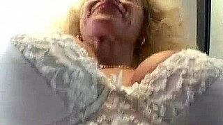 Aroused granny indulges in explicit porn, enjoying voyeuristic delight and satisfying her desires with a willing partner.