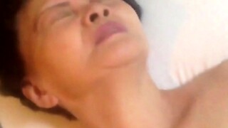 Chinese grandma gets naughty in a hot and steamy video.