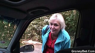 Older woman enjoys oral sex and penetration from friends in car.